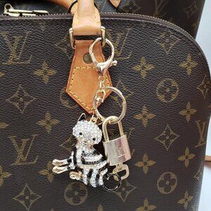 Authentic Louis Vuitton Lock & Key with unbranded Cat Bagcharm, Keycharm